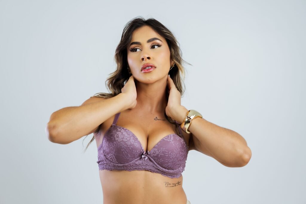 pexels-photo-31094968-31094968 Stylish woman wearing lavender lace lingerie posing with confidence.